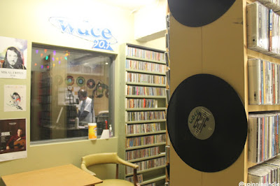 WDCE image of station with record shelves and audio booth. Source from Spinning Indie blog